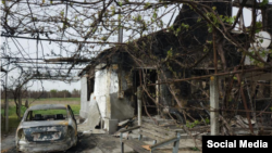 Один из домов в поселке Абрикосовка Херсонской области, сожженных российскими военными, подозреваемыми в убийствах