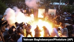 Armenia - A police stun grenade explodes during a rally against Prime Minister Nikol Pashinian in Yerevan, June 12, 2024. (Vahram Baghdasaryan/Photolur via AP)