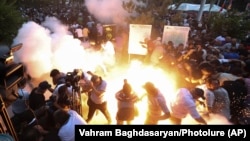 Armenia - A police stun grenade explodes during a rally against Prime Minister Nikol Pashinian in Yerevan, June 12, 2024.