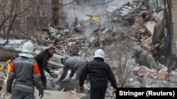 Rescuers work at the site of a Russian drone attack in Odesa on March 2. 