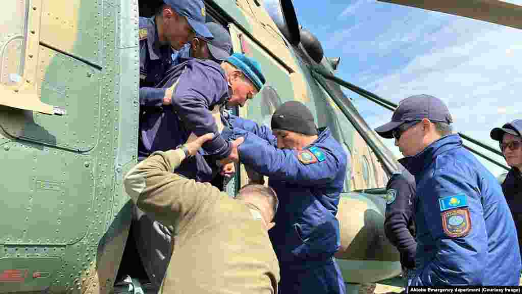 A Kazakh government handout photo shows evacuees being rescued by a military helicopter on April 15.&nbsp; Toqaev assured evacuees that the government would not leave them without assistance.&nbsp;&quot;The state will take care of every citizen, every family. This is my priority,&quot; he vowed.