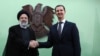 Iranian President Ebrahim Raisi (left) shakes hand with his Syrian counterpart, Bashar al-Assad, in Damascus on May 3. 