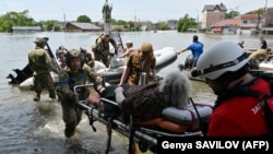 Volunteers Struggle To Rescue Elderly Trapped By Floodwaters In Kherson