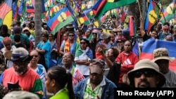 Indigenous Kanaks take to the streets in April in the French territory of New Caledonia to protest a proposed change to the electoral law.