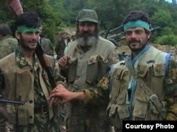 Tengiz Tsulukiya (right) with other Abkhaz fighters during the war