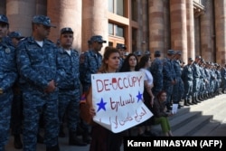 Armenians protest to urge the government to respond to the Azerbaijani military operation.