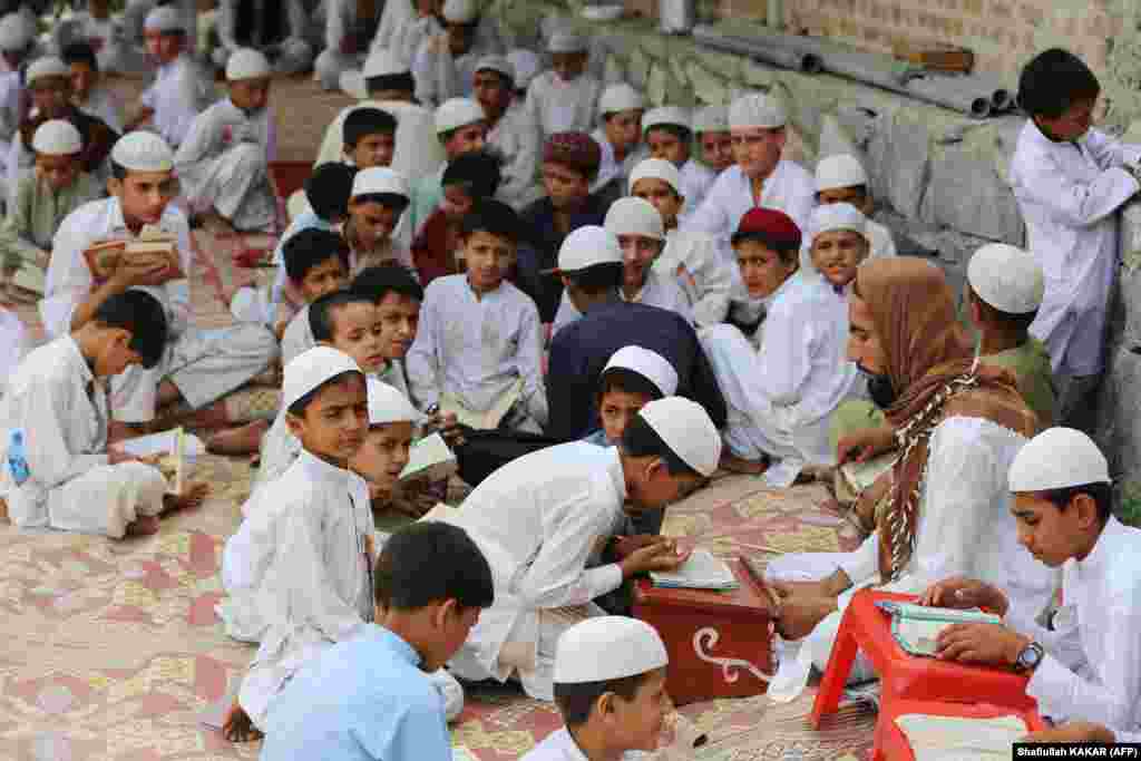 Afghan boys learn the Koran at a madrasah in the Kama district of Nangarhar Province.