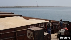 A barge carrying Ukrainian grain is moored for unloading at the Romanian port of Constanta. (file photo)