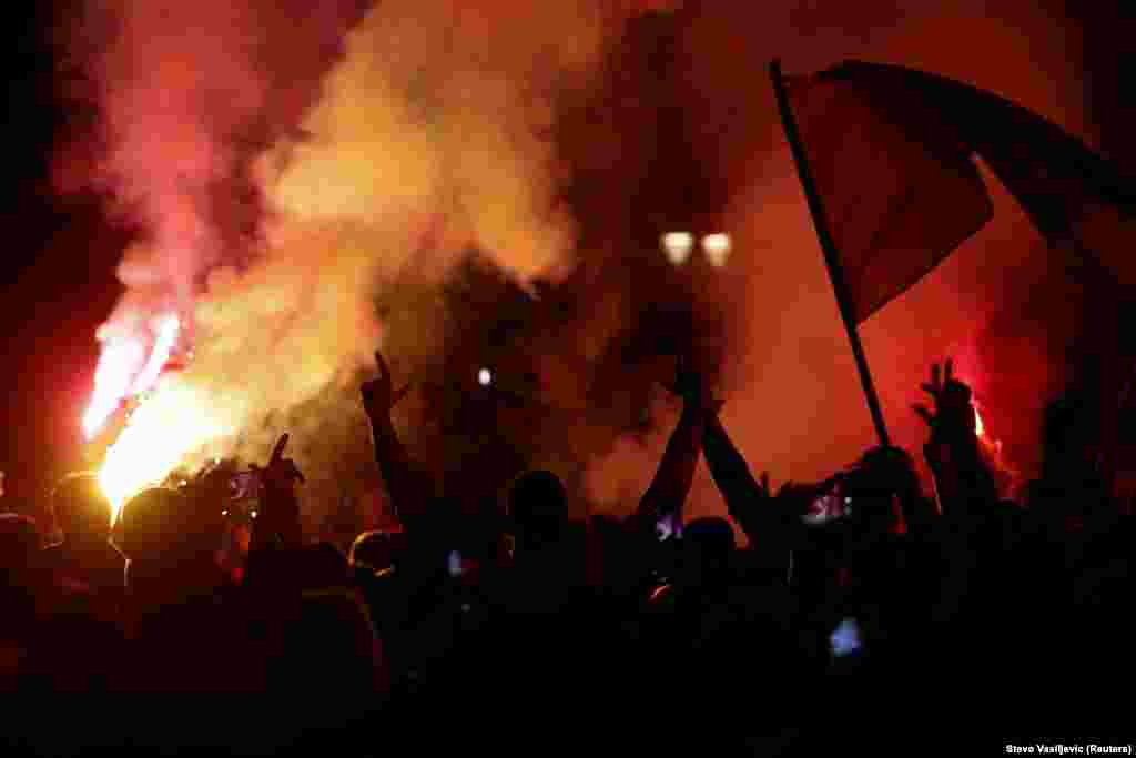 Opposition supporters light flares during a protest against Andrija Mandic, a pro-Serbian and pro-Russian leader of the alliance For the Future of Montenegro, who was elected as the new parliament speaker, in Podgorica on October 30.