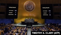 Screens display the vote count during the 11th Emergency Special Session of the General Assembly on Ukraine, at UN headquarters in New York City on February 23.