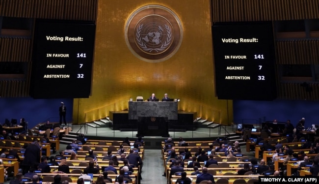 Screens display the vote count during the 11th Emergency Special Session of the General Assembly on Ukraine, at UN headquarters in New York City on February 23.