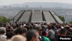 People march on April 24 to the Tsitsernakaberd memorial in Yerevan to commemorate the Armenian genocide.