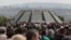 People march on April 24 to the Tsitsernakaberd memorial in Yerevan to commemorate the Armenian genocide.