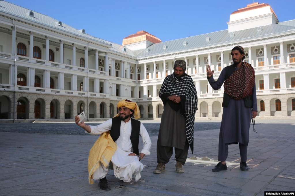 Afghans take selfies at the renovated Darul Aman Palace in the Afghan capital, Kabul.