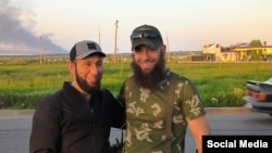 Chechen military volunteers pose west of the village of Azov in Ukraine's Zaporizhzhya region on May 20.