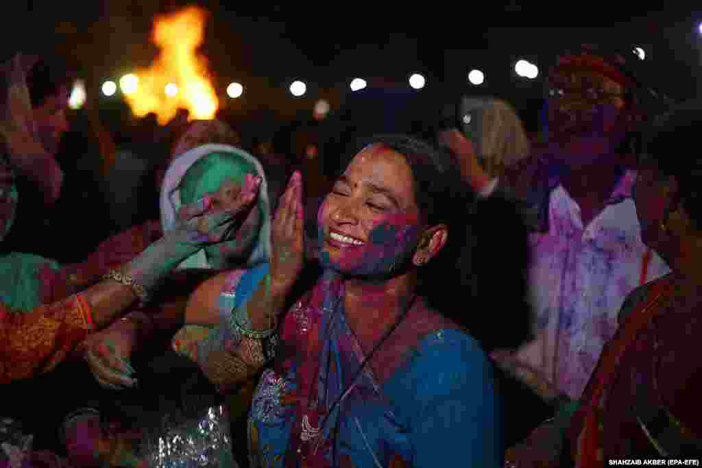 Members of the Pakistani Hindu community, with their faces painted or otherwise stained in colors, celebrate the festival of Holi in Karachi. Holi, also known as the Festival Of Colors, is an ancient Hindu festival symbolizing the victory of good over evil and marking the arrival of spring.