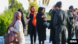 Iranian security officers patrol the streets for alleged head-scarf violations on March 4. 