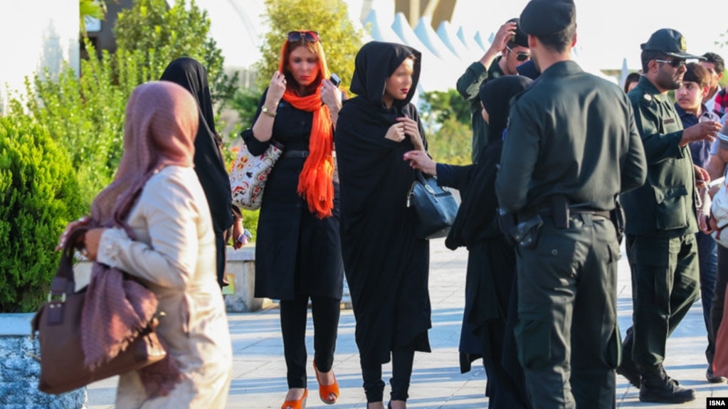 Security forces in Iran warn women to wear their hijabs properly.