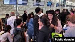 Israel - Armenians check in for an evacuation flight to Yerevan at Tel Aviv's Ben Gurion Airport, October 16, 2023.