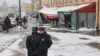 Police officers stand guard at the scene of an explosion in St. Petersburg that killed Russian military blogger Vladlen Tatarsky. 