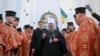 The head of the Orthodox Church of Ukraine, Metropolitan Epifaniy (center) said the move was "vitally necessary." 