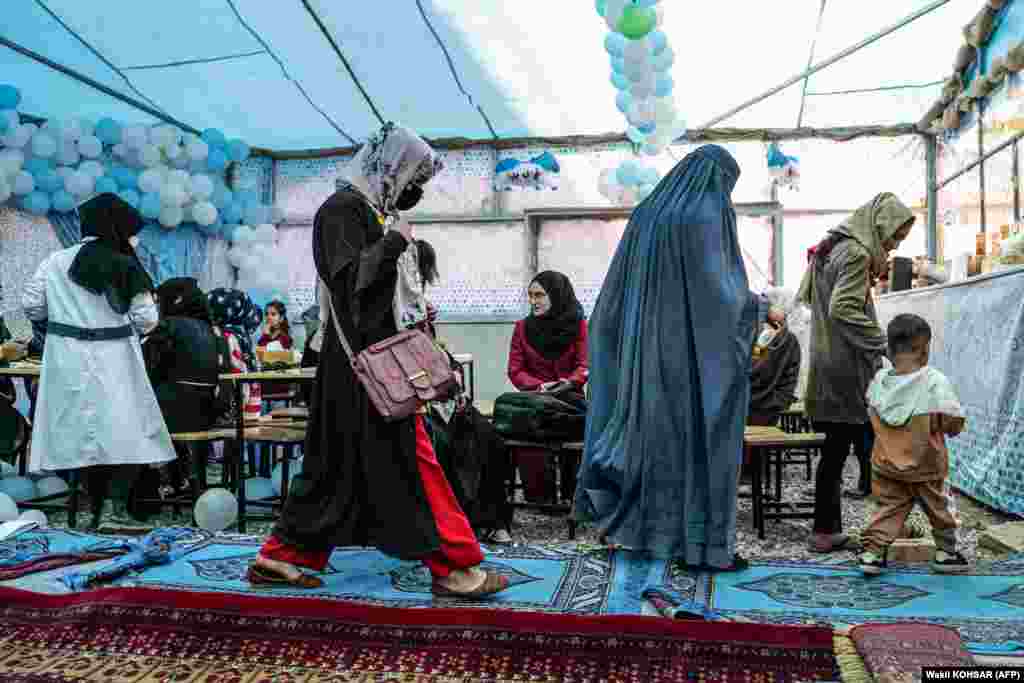 Customers arrive to eat at the Banowan-e-Afghan restaurant, which employs female staff, in Kabul.