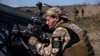 UKRAINE – A Ukrainian serviceman of the 108th Separate Brigade of Territorial Defence points a small multiple launch rocket system before firing toward Russian troops, amid Russia's attack on Ukraine, near a front line in Zaporizhzhia region, 19Aug2023