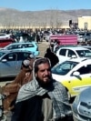 A screen grab from a video made in February shows Afghan men leaving a football stadium after attending the public execution by Taliban authorities of two men convicted of murder. 