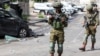 Israeli soldiers patrol in the city of Sderot near a police station that was the site of a battle following a mass incursion across the order by Hamas gunmen from the Gaza Strip on October 7. 