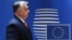 Hungarian Prime Minister Viktor Orban arrives for an EU summit in Brussels. Can Brussels outmaneuver Budapest on Russia sanctions? (file photo)