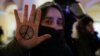 A demonstrator shows a peace symbol painted on her hand during an anti-war protest against Russia's invasion of Ukraine in St. Petersburg on March 2, 2022.