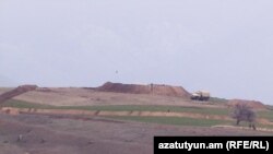 Armenia - An Azerbaijani army post is seen from the border village of Tegh, March 31, 2023.