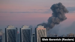 Smoke rises in the sky over Kyiv after a deadly Russian missile and drone strike on Ukraine's capital on December 29. 