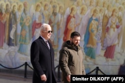 U.S. President Joe Biden (left) walks next to Ukrainian President Volodymyr Zelenskiy during his surprise visit to Kyiv on February 20.