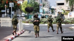 Ізраїльські солдати під час патрулювання в Сдероті, на півдні Ізраїлю, 11 жовтня 2023 року