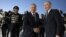 Uzbek President Shavkat Mirziyoev (left) welcomes Russian President Vladimir Putin at Tashkent's airport in May. 