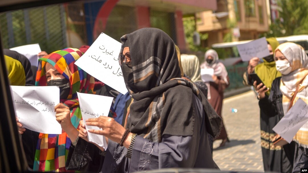 Afghan women hold placards as they march to protest for their rights in Kabul on April 29.
