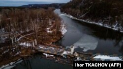 This aerial photograph shows a destroyed bridge in the village of Bohorodychne, Donetsk region, on February 21.