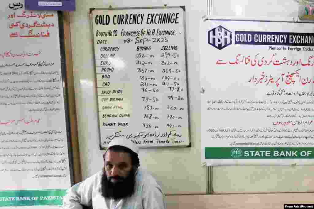 A man sits near a currency exchange rate board in Peshawar. Existing exchange companies that meet the minimum capital requirement are to be consolidated into a single category. The closure of the illegal exchange business coincides with a renewed focus on tackling the problems of commodity hoarders and electricity and gas thieves. &nbsp; &nbsp;