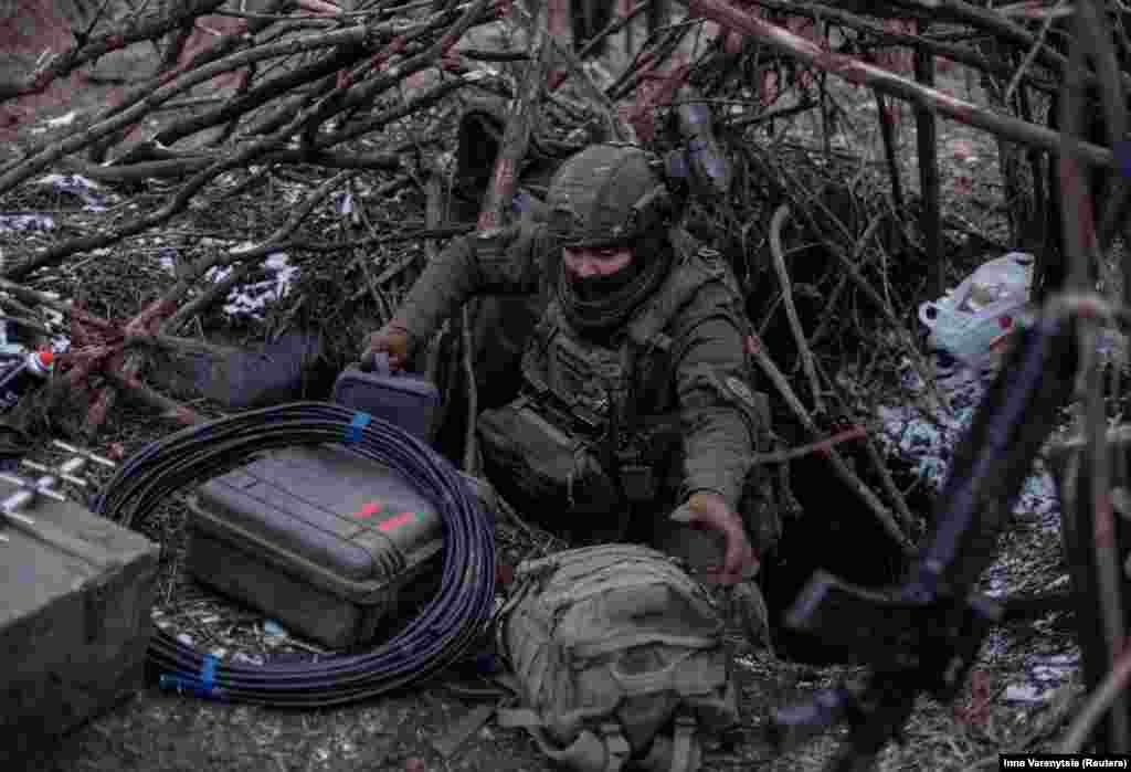 A Ukrainian serviceman emerges from a hideout near Avdiyivka on February 20 to launch a drone.&nbsp; Ukraine&#39;s military pulled back to prepared defensive lines after February 17 and is still within drone range of the captured city.&nbsp; &nbsp;