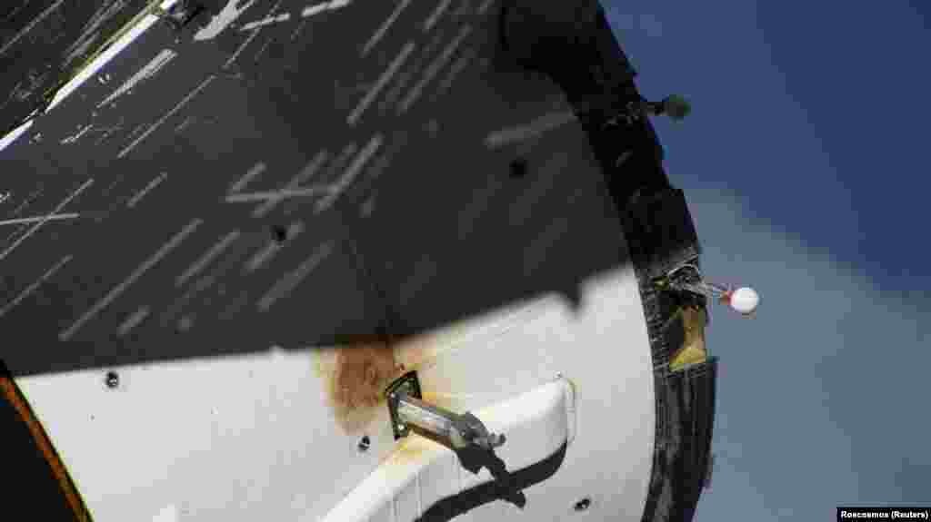 A view shows external damage believed to have caused a loss of pressure in the cooling system of the Soyuz MS-22 spacecraft docked at the ISS.