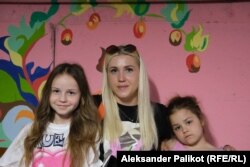 Alina, Lisa, and Alisa Melnychenko planned to spend the Children's Day in a bomb shelter at the local school.