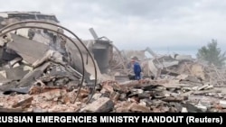 A rescuer with a dog works at the site of the blast in Sergiyev Posad on August 9.