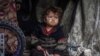 Газанын Рафах шаарындагы качкындар лагеринде тамак жеп аткан бала. 14-март, 2024-жыл. 