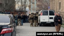 Armenia - Security forces are seen near a police station in Yerevan's Nor Nork district attacked by three men, March 24, 2024