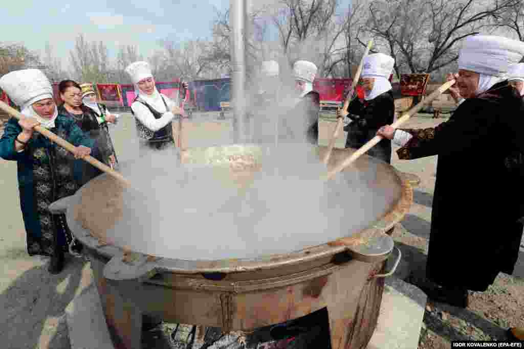 Women cook a traditional dish for the celebrations in Bishkek.