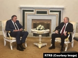 Milorad Dodik (left), leader of Bosnia's Serbian entity, meets with Russian President Vladimir Putin in St. Petersburg on June 6.