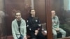 Кирилл Суханов, Тамерлан Бигаев и Ариан Романовский (слева направо) в суде