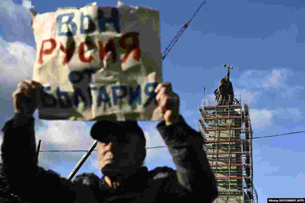 A man supporting the removal of the landmark holds a sign saying &ldquo;Get Russia out of Bulgaria.&rdquo; Others in Bulgaria have long viewed the landmark as an insult to the memories of Bulgarians who suffered under the country&rsquo;s Soviet-backed communist regime. &nbsp;