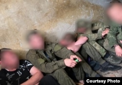 Russian mobilized soldiers are kept in a penalty room known as "the pit" as a punishment for complaints or insubordination, in Korenevo, Ukraine's Kursk region, in July.